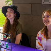 Students working a booth during Student Small Business Market.